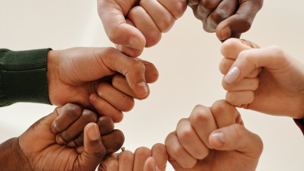 Fists of people with different skin tone